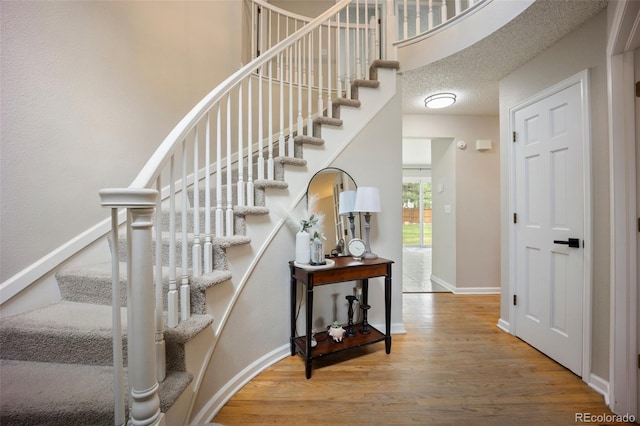5552 S Lisbon Ln, Centennial, CO 80015 - stairs with wood finished floors and baseboards