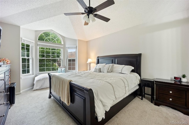 5552 S Lisbon Ln, Centennial, CO 80015 - bedroom with vaulted ceiling, light carpet, a textured ceiling, and a ceiling fan