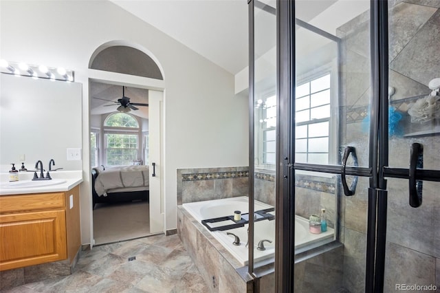5552 S Lisbon Ln, Centennial, CO 80015 - full bath with connected bathroom, vanity, lofted ceiling, a bath, and a ceiling fan