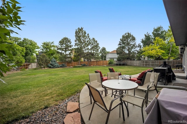 5552 S Lisbon Ln, Centennial, CO 80015 - fenced backyard with a patio area