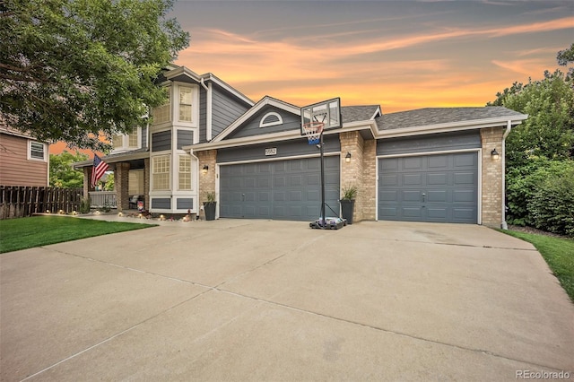 5552 S Lisbon Ln, Centennial, CO 80015 - view of front of property with brick siding, driveway, and a garage