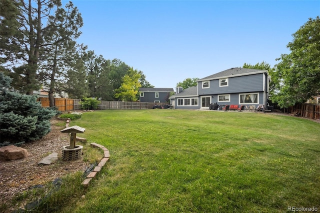 5552 S Lisbon Ln, Centennial, CO 80015 - fenced backyard featuring a patio area