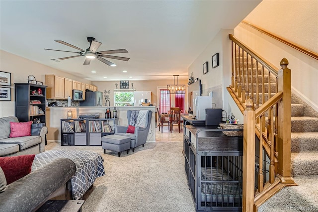 17390 Waterhouse Cir Unit B, Parker, CO 80134 - living room featuring light colored carpet, a chandelier, a ceiling fan, stairway, and recessed lighting