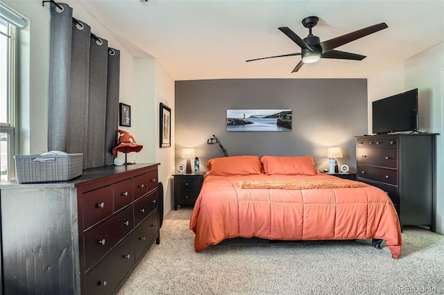 17390 Waterhouse Cir Unit B, Parker, CO 80134 - bedroom featuring light colored carpet, multiple windows, and a ceiling fan