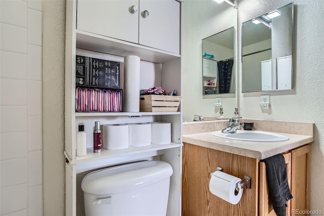 17390 Waterhouse Cir Unit B, Parker, CO 80134 - full bathroom with vanity and a textured wall