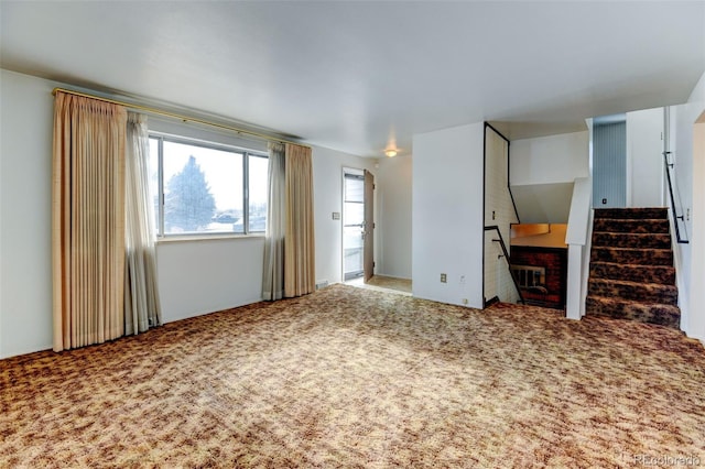 unfurnished living room with carpet flooring