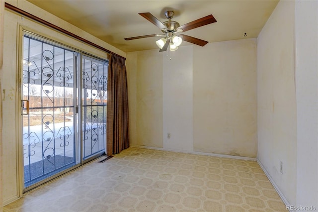 spare room with ceiling fan