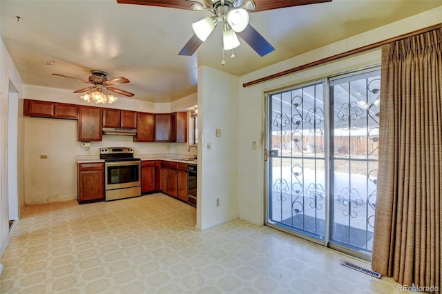 kitchen with electric stove, sink, black dishwasher, and ceiling fan