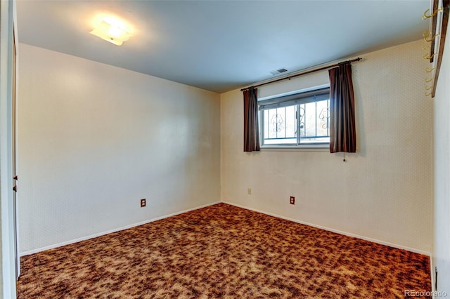 unfurnished room featuring carpet flooring