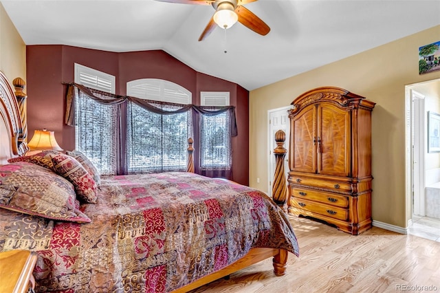 bedroom with vaulted ceiling, light hardwood / wood-style floors, and ceiling fan