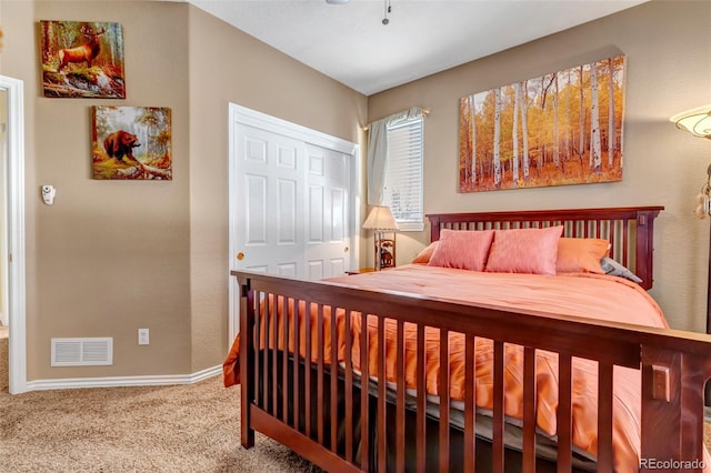 bedroom featuring a closet and carpet flooring