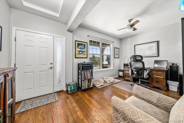 office space with wood finished floors and a ceiling fan