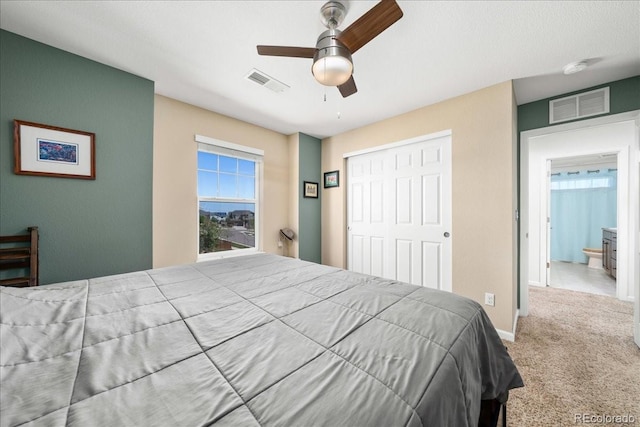 bedroom featuring carpet flooring, a closet, a ceiling fan, and visible vents