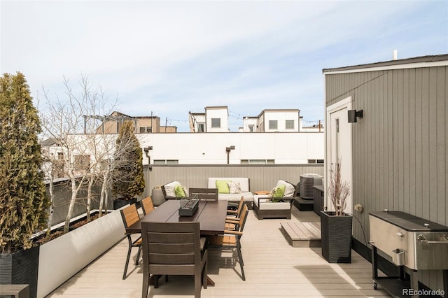 deck featuring outdoor lounge area and central AC