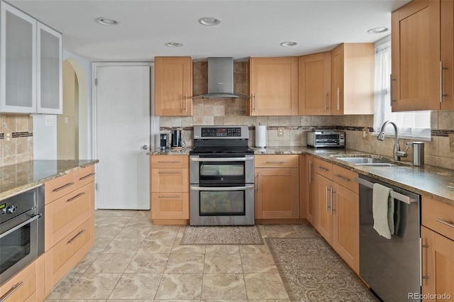 6854 S Willow St, Centennial, CO 80112 - kitchen with wall chimney range hood, appliances with stainless steel finishes, tasteful backsplash, a sink, and a toaster