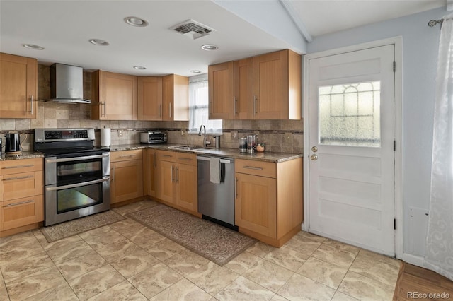 6854 S Willow St, Centennial, CO 80112 - kitchen with decorative backsplash, visible vents, a sink, stainless steel appliances, and wall chimney exhaust hood