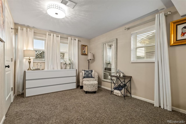 6854 S Willow St, Centennial, CO 80112 - living area featuring baseboards, visible vents, and carpet