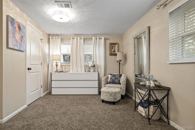 6854 S Willow St, Centennial, CO 80112 - living area with baseboards, visible vents, and carpet