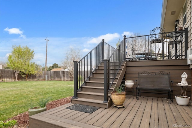6854 S Willow St, Centennial, CO 80112 - wooden deck with stairway, a lawn, and a fenced backyard