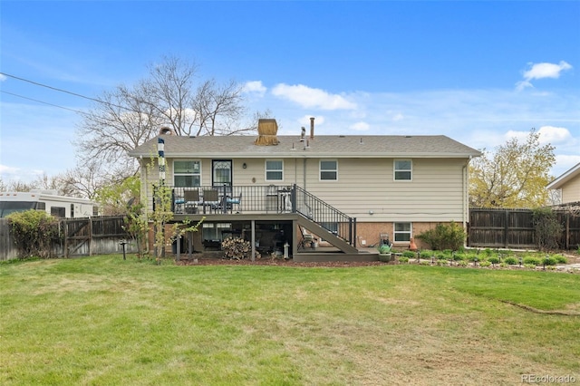 6854 S Willow St, Centennial, CO 80112 - back of house featuring stairway, a lawn, a wooden deck, and a fenced backyard