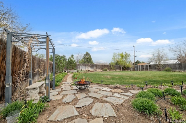 6854 S Willow St, Centennial, CO 80112 - view of yard featuring a fenced backyard, a patio, and a fire pit