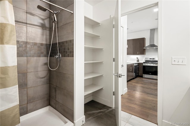 bathroom with a shower stall, vanity, and tile patterned floors