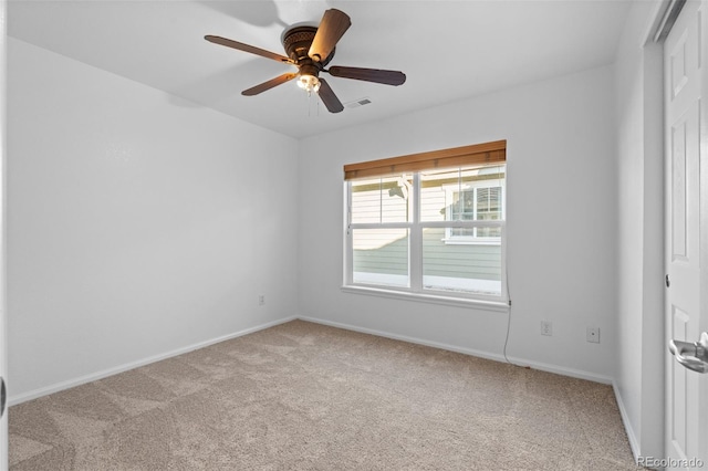 unfurnished room with ceiling fan and light colored carpet