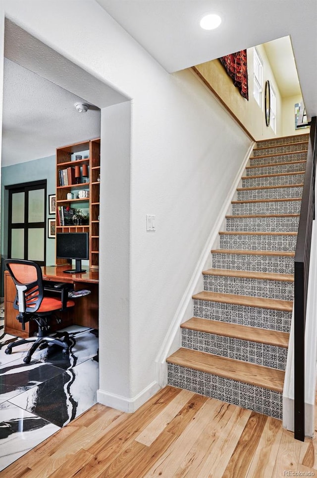751 Poplar St, Denver, CO 80220 - stairs featuring wood finished floors and baseboards