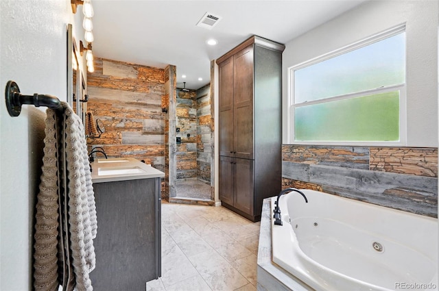 751 Poplar St, Denver, CO 80220 - bathroom with a stall shower, a whirlpool tub, marble finish floors, wooden walls, and vanity