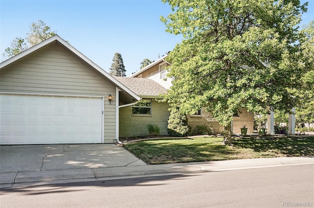 751 Poplar St, Denver, CO 80220 - view of front of property featuring brick siding, driveway, an attached garage, a front lawn, and roof with shingles
