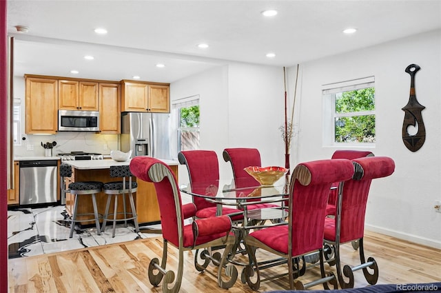 751 Poplar St, Denver, CO 80220 - dining area featuring healthy amount of natural light, light wood-style floors, and recessed lighting