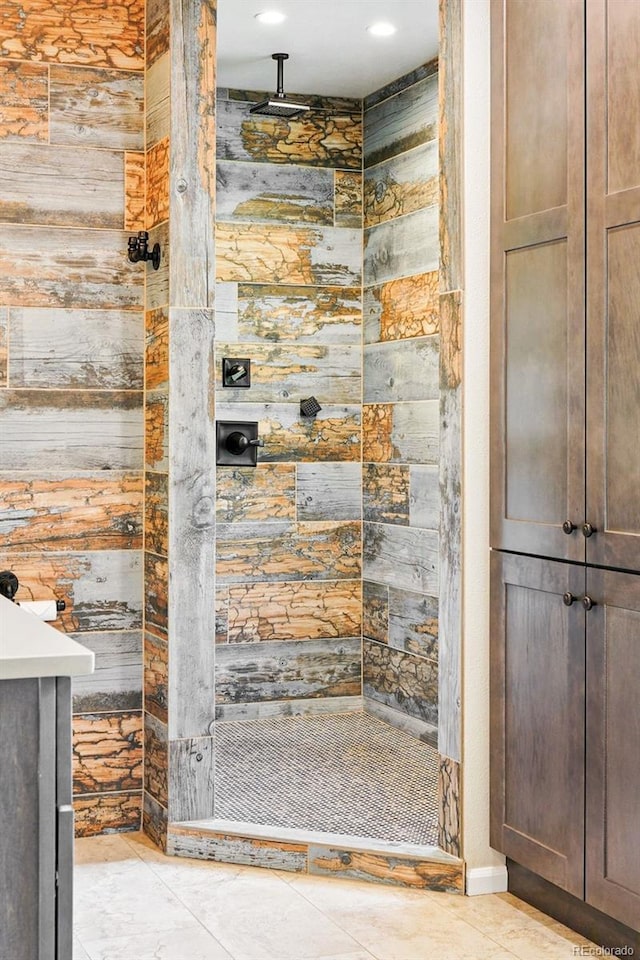 751 Poplar St, Denver, CO 80220 - bathroom with a shower stall, wooden walls, vanity, and tile patterned floors