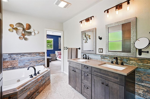 751 Poplar St, Denver, CO 80220 - bathroom featuring double vanity, a whirlpool tub, and ensuite bathroom