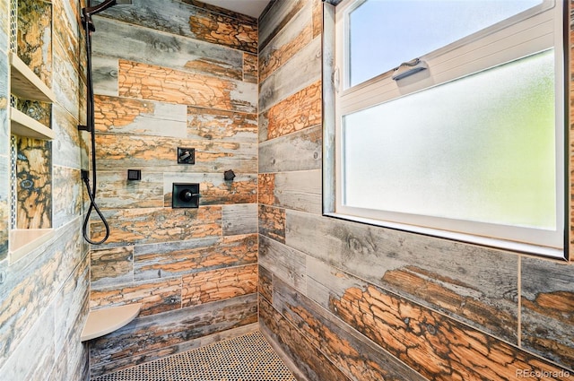 751 Poplar St, Denver, CO 80220 - bathroom featuring a tile shower and wooden walls