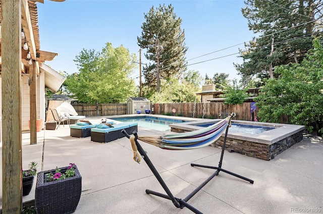 751 Poplar St, Denver, CO 80220 - view of swimming pool with a storage shed, a patio, a fenced backyard, and a fire pit