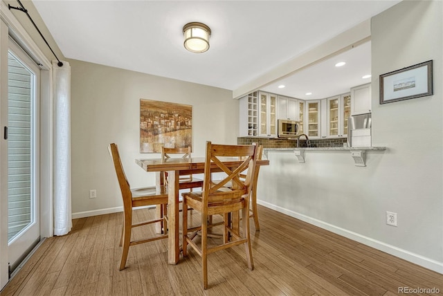 dining room featuring light hardwood / wood-style flooring