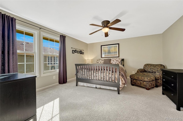 carpeted bedroom featuring ceiling fan