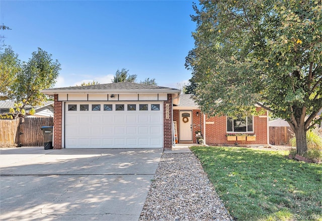 single story home with a front lawn and a garage