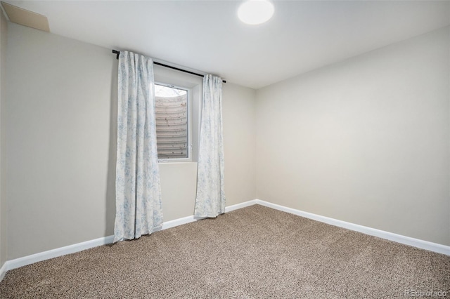 empty room with carpet flooring