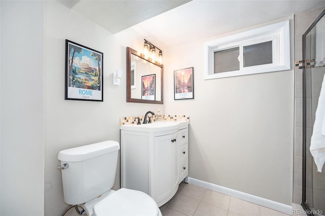 bathroom with a textured ceiling, tile patterned flooring, vanity, and toilet