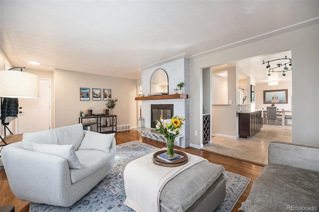 living room featuring a fireplace and light hardwood / wood-style floors