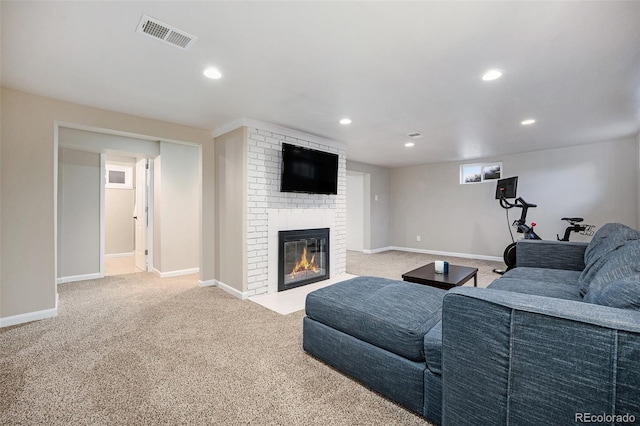 carpeted living room featuring a brick fireplace