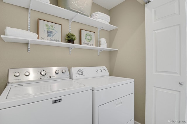 laundry area featuring washing machine and dryer