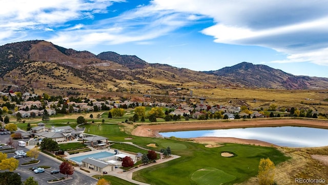 birds eye view of property featuring a residential view and a water and mountain view