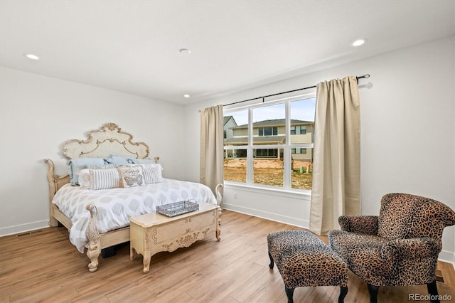 bedroom featuring light hardwood / wood-style flooring