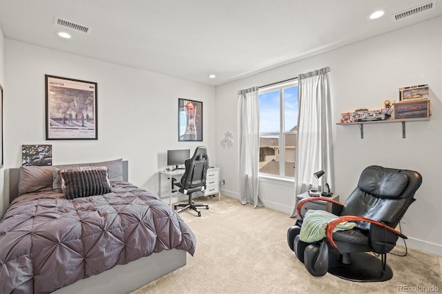 bedroom featuring light colored carpet