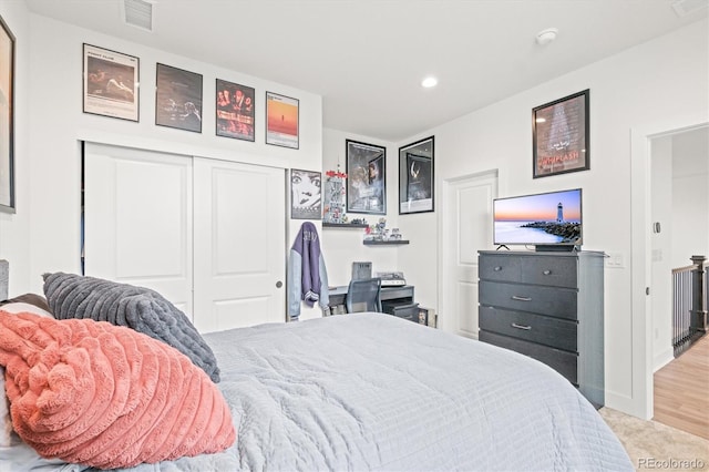 bedroom featuring a closet and light hardwood / wood-style floors