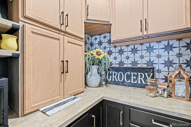 kitchen with backsplash and light brown cabinetry