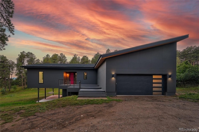 contemporary home featuring driveway and an attached garage