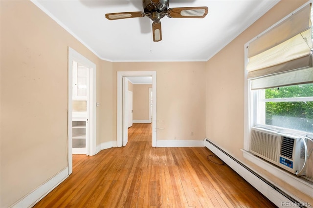 130 S Humboldt St, Denver, CO 80209 - unfurnished room featuring a baseboard heating unit, light wood finished floors, ornamental molding, baseboards, and ceiling fan
